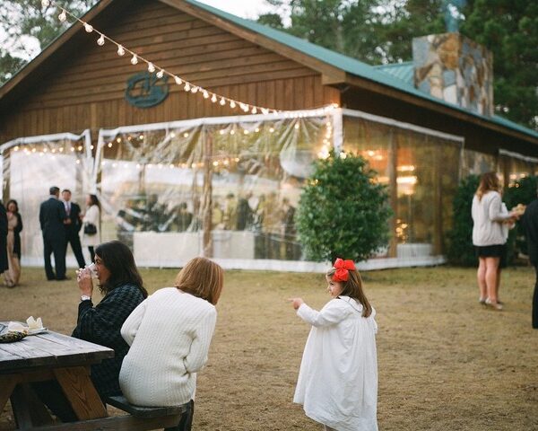 Pavilion outfitted with plastic sides during December wedding reception.