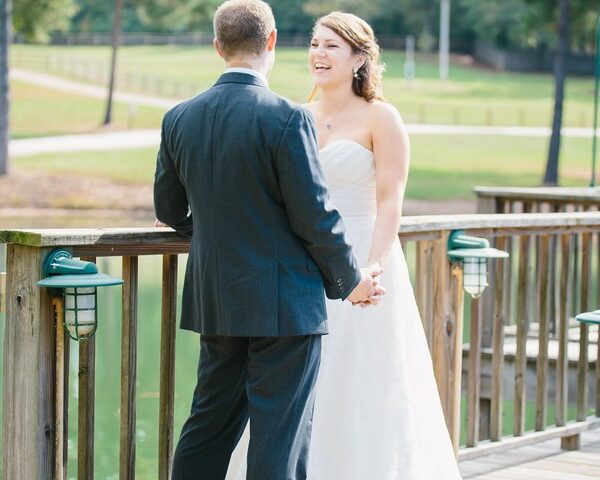 Bride and groom on the lower pond pier.