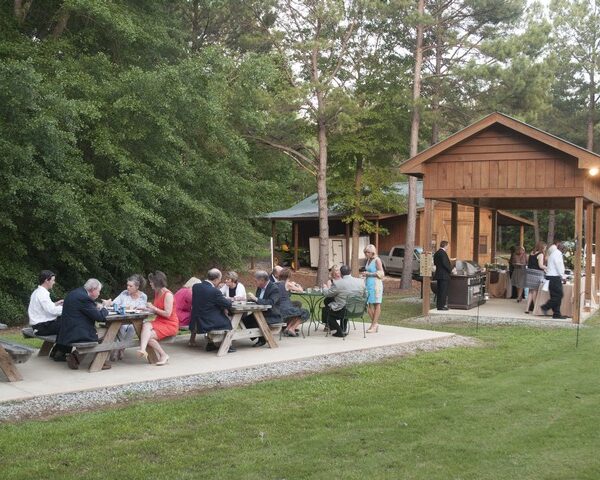 The Cooking Shelter with extra seating on the Shuffleboard Court.